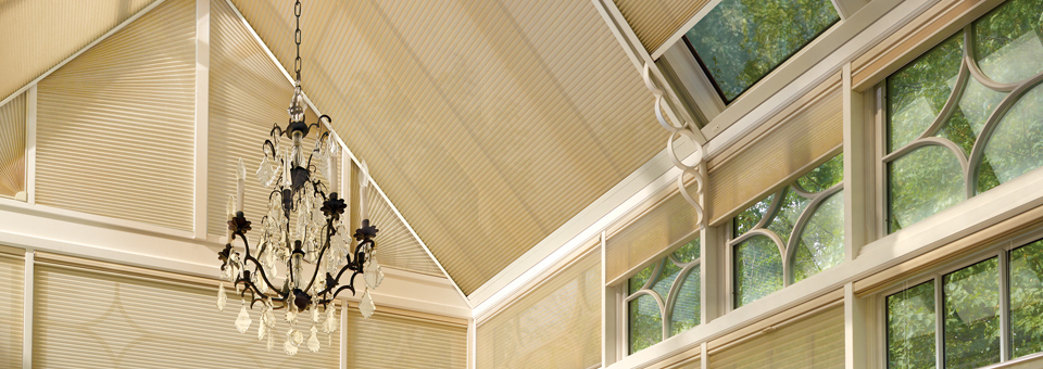 three seasons room with honeycomb shades on glass ceiling in Roseville CA