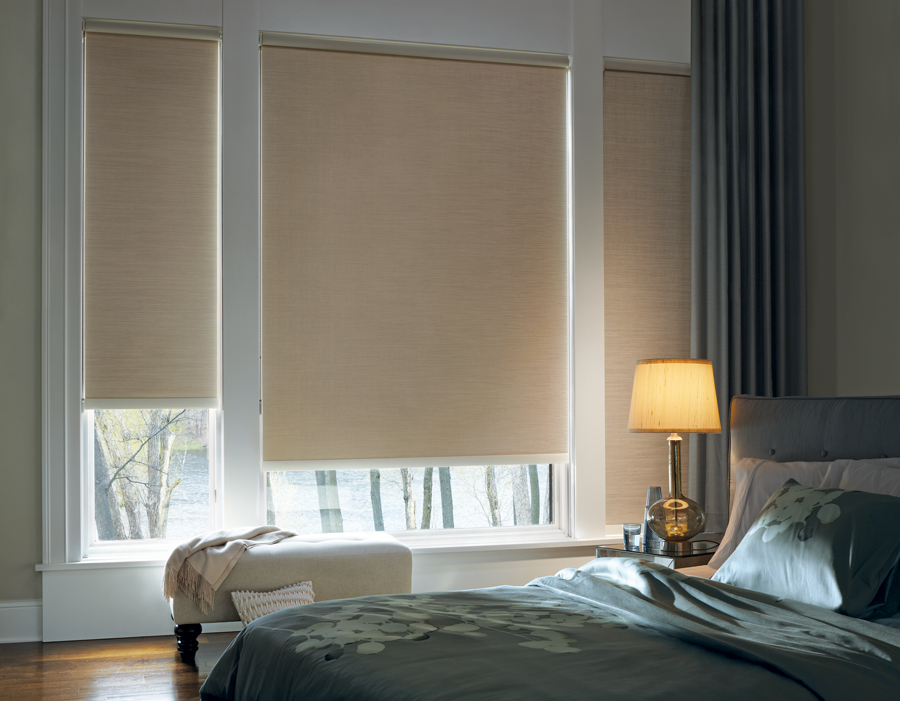 Beautifully decorated guest bedroom blackout roller shades Hunter Douglas Roseville 95661