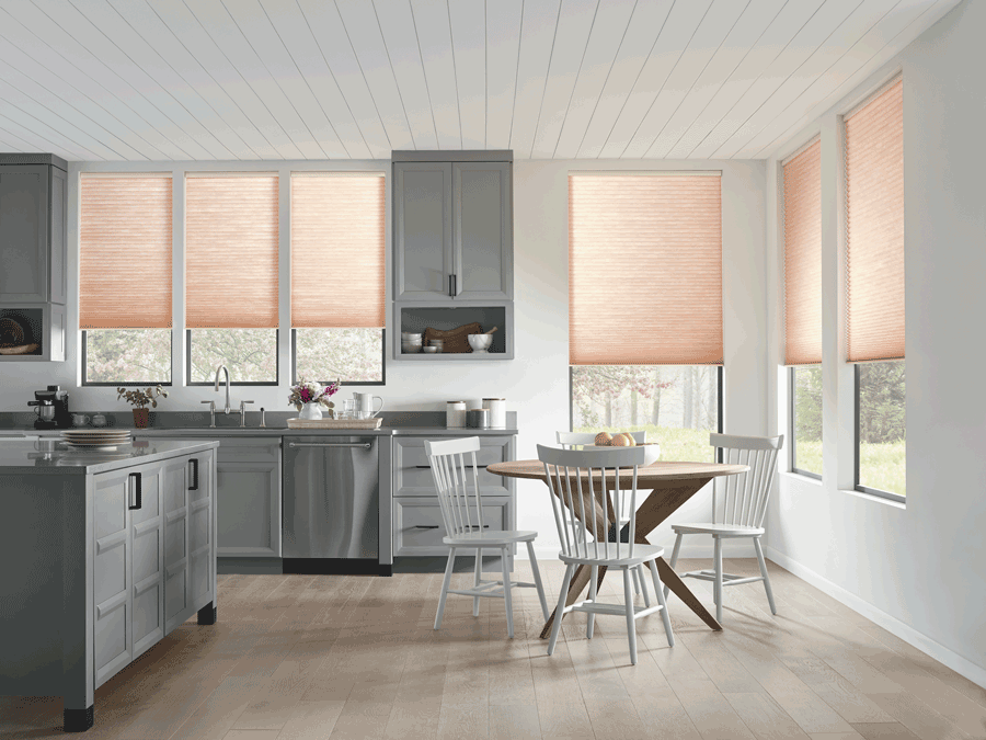 Modern kitchen with motorized shades half drawn.