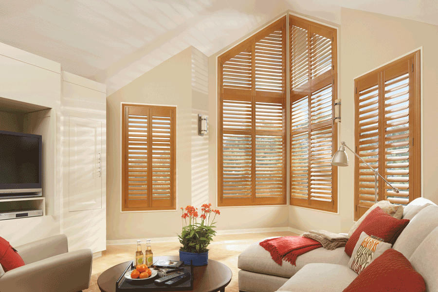 medium wood tone interior shutters for angled windows Hunter Douglas Folsom 95630