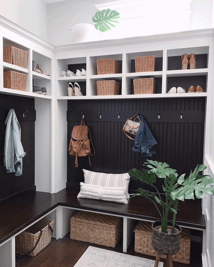 black wainscoting mudroom lockers with textured baskets