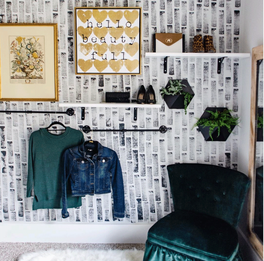 walk-in closet with hand-stamped feature wall