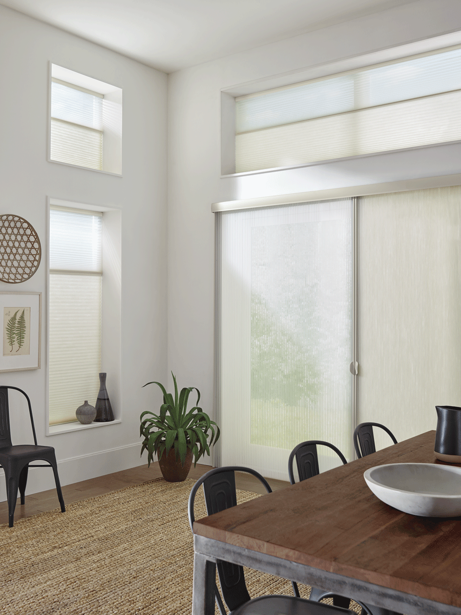 Honeycomb shades on sliding doors.