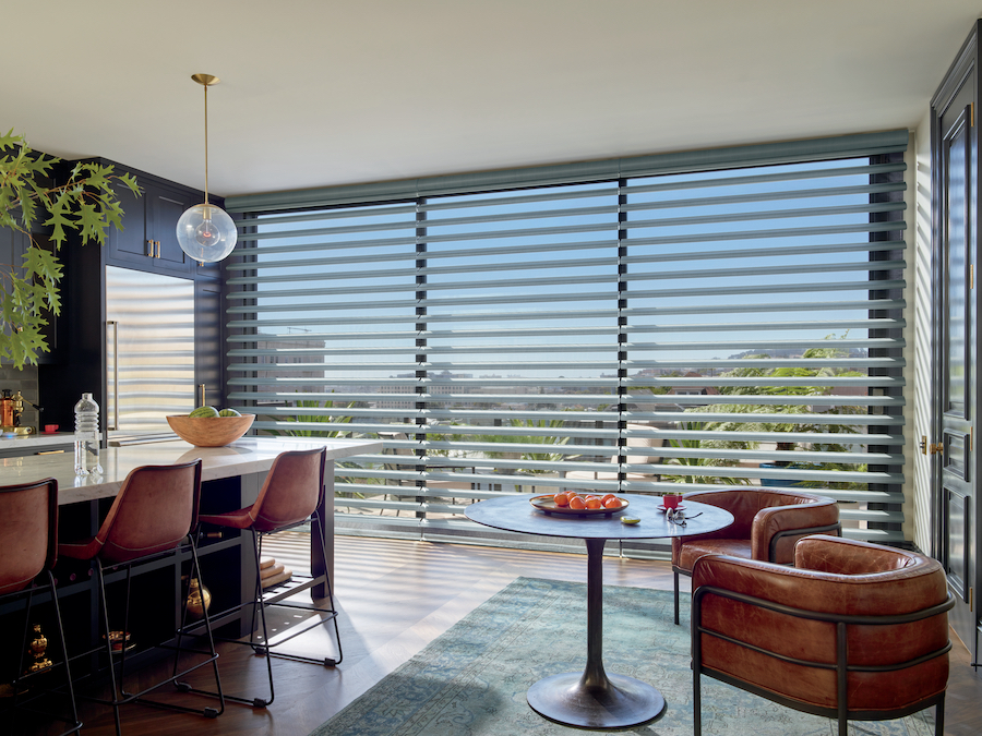 Motorized sheer Pirouette shades floor to ceiling.