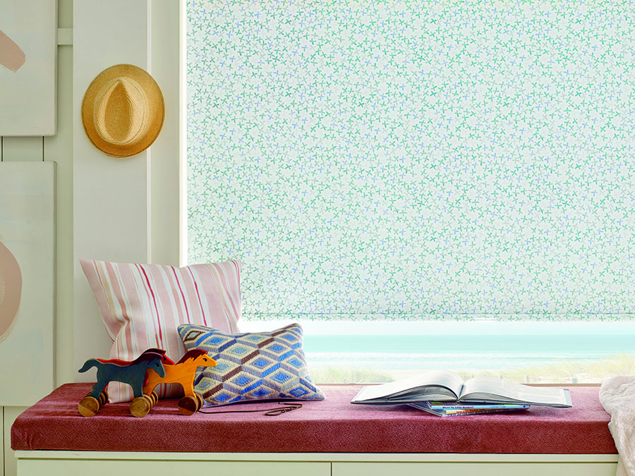 Window seat with different patterned accents.