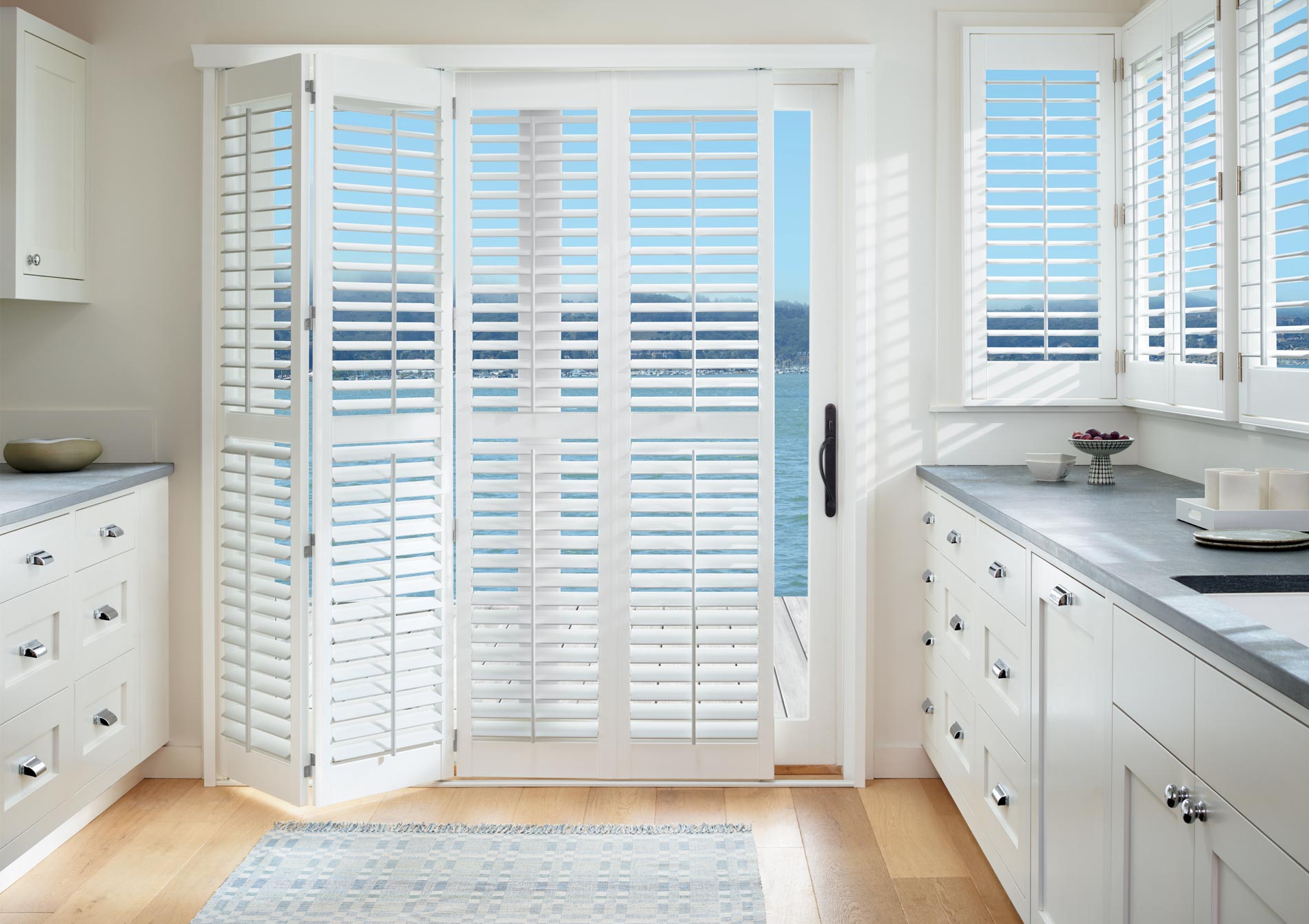 bi-fold shutters in white Folsom, CA kitchen