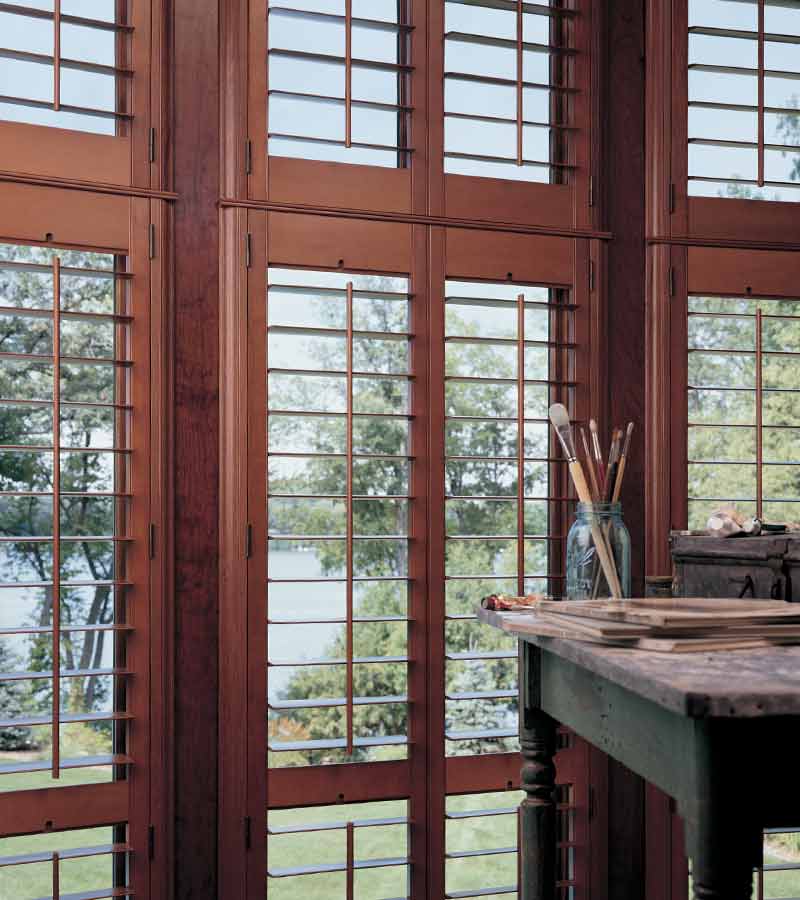 cherry stained wood shutters by hunter douglas in artist studio El Dorado Hills, CA