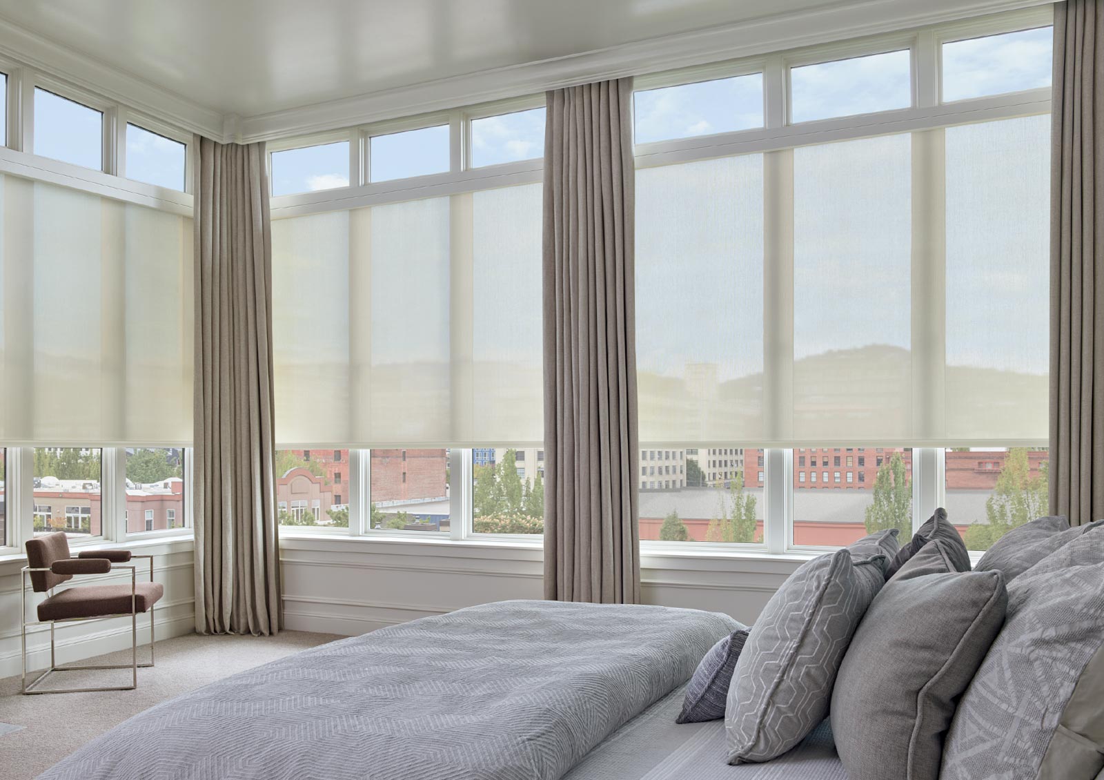 tall windows on entire wall with draperies and roller screen shades in Lincoln, Ca