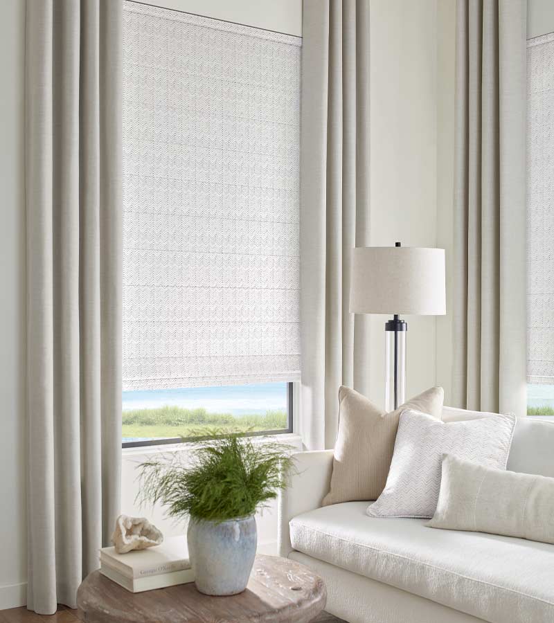 design studio roman shades and cream drapery coastal decor