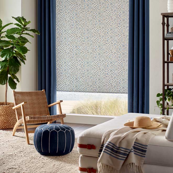 design studio roller shades and blue drapery