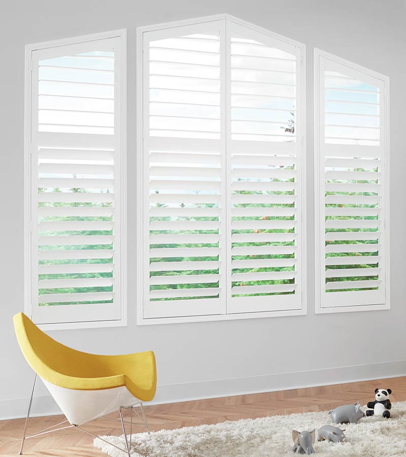 white shutters in angled windows in childrens playroom roseville, ca