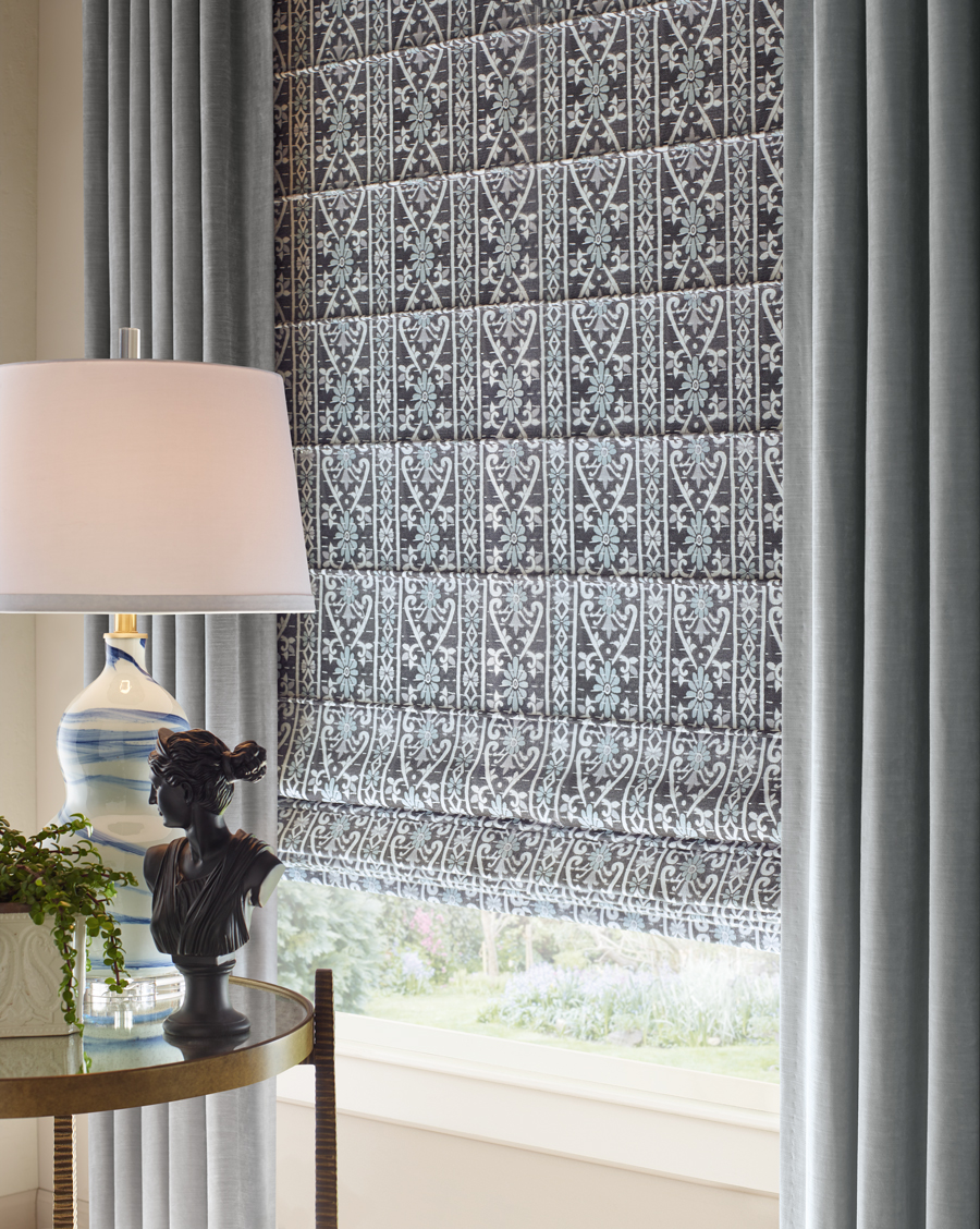 patterned roman shades with side drapery panels