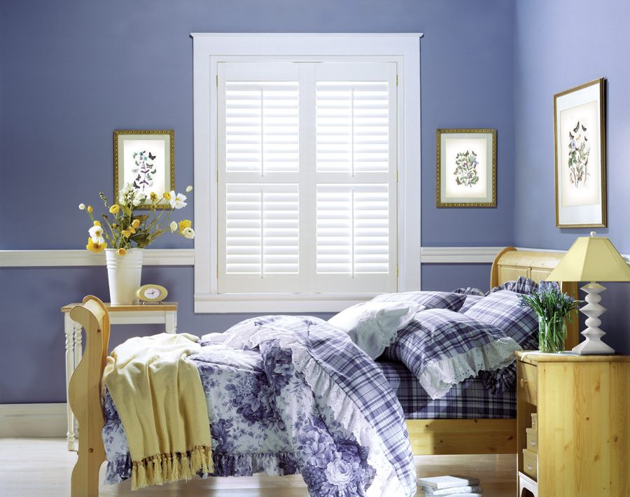 bedroom with white shutters very peri 