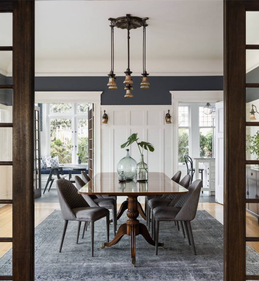 Dining room hardwood floor with area rug