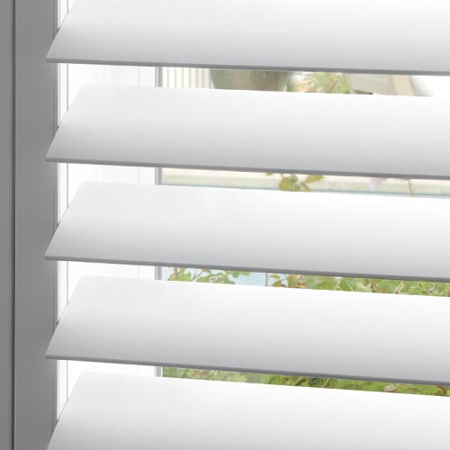 close up of white shutter louvers