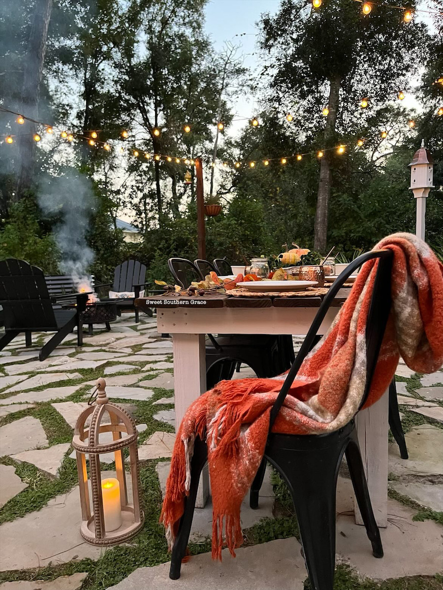 Outdoor dining area under lights