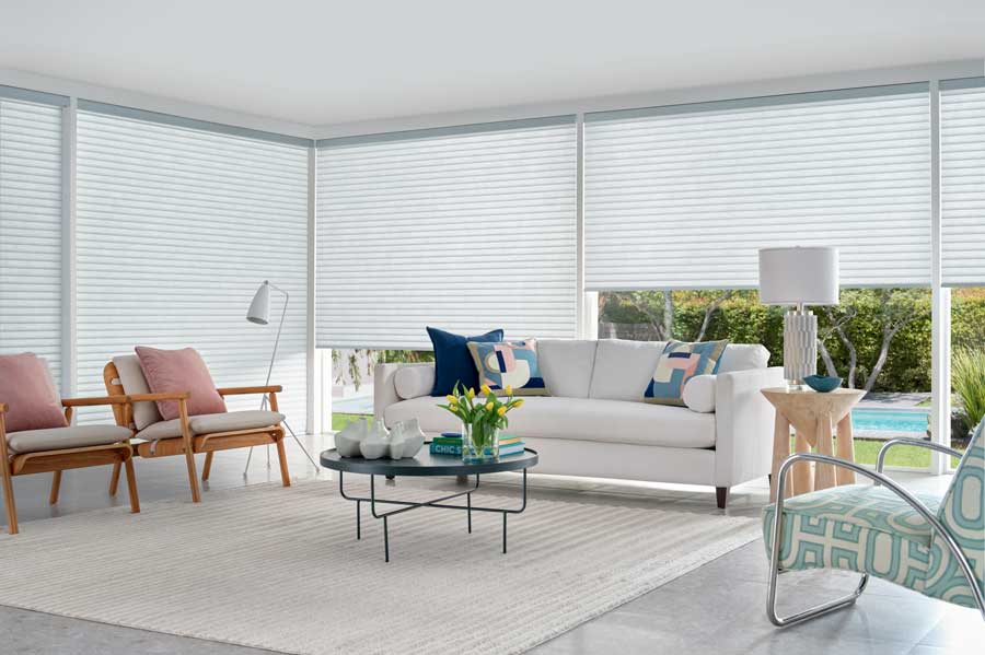 Bright living room with Sonnette Cellular Roller Shades in open roseville, ca home