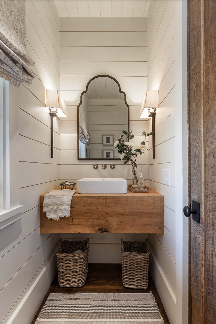 White shiplap walls in powder bathroom