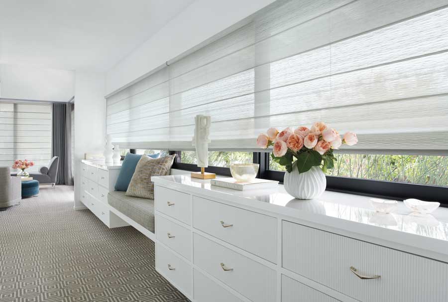 Sitting area with white roman shades