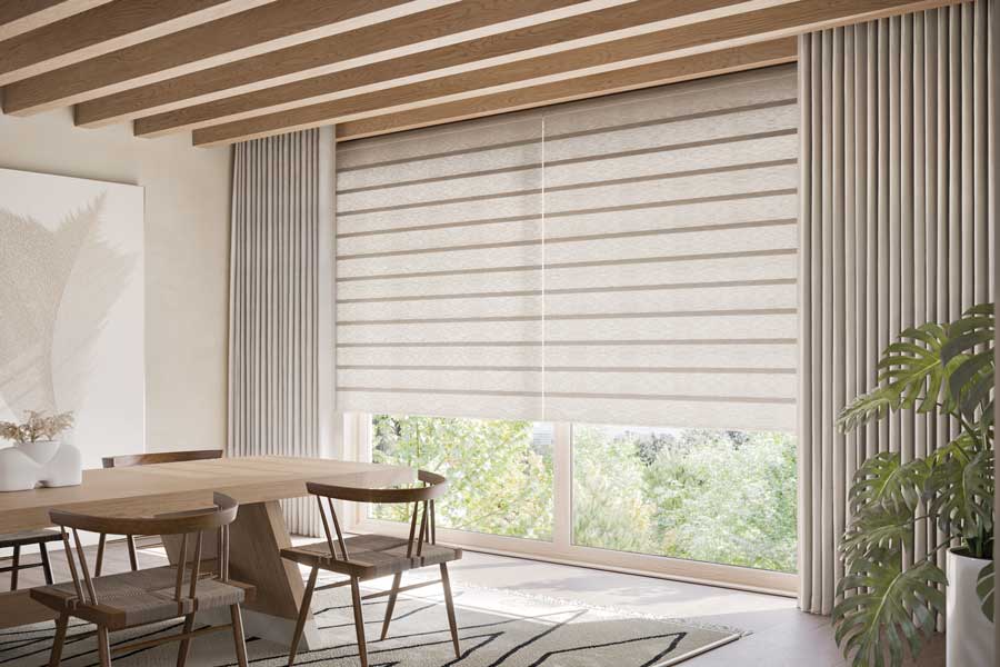 Rolling roman shades on floor to ceiling windows