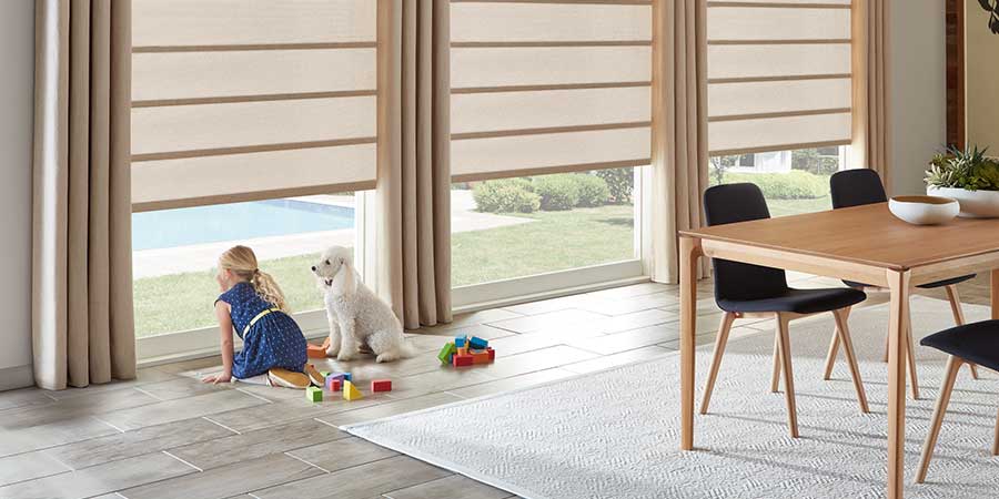 Alustra® Architectural Roller Shades in dining room with PowerView® automation for child and pet safety