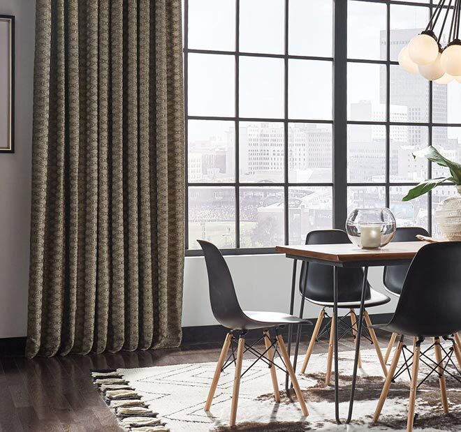 custom drapery panels helping block sunlight and heat in living space