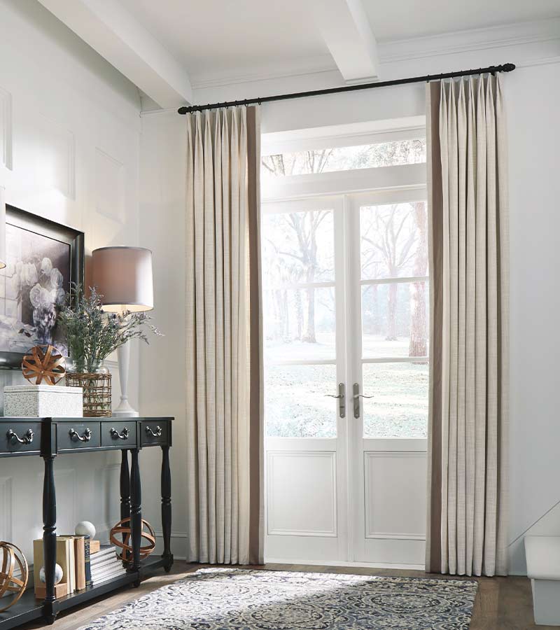 euro pleat drapery in a traditional home over french doors in Rocklin CA home entryway