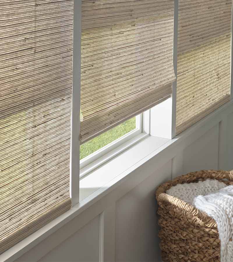 Bedroom with neutral provenance woven blinds