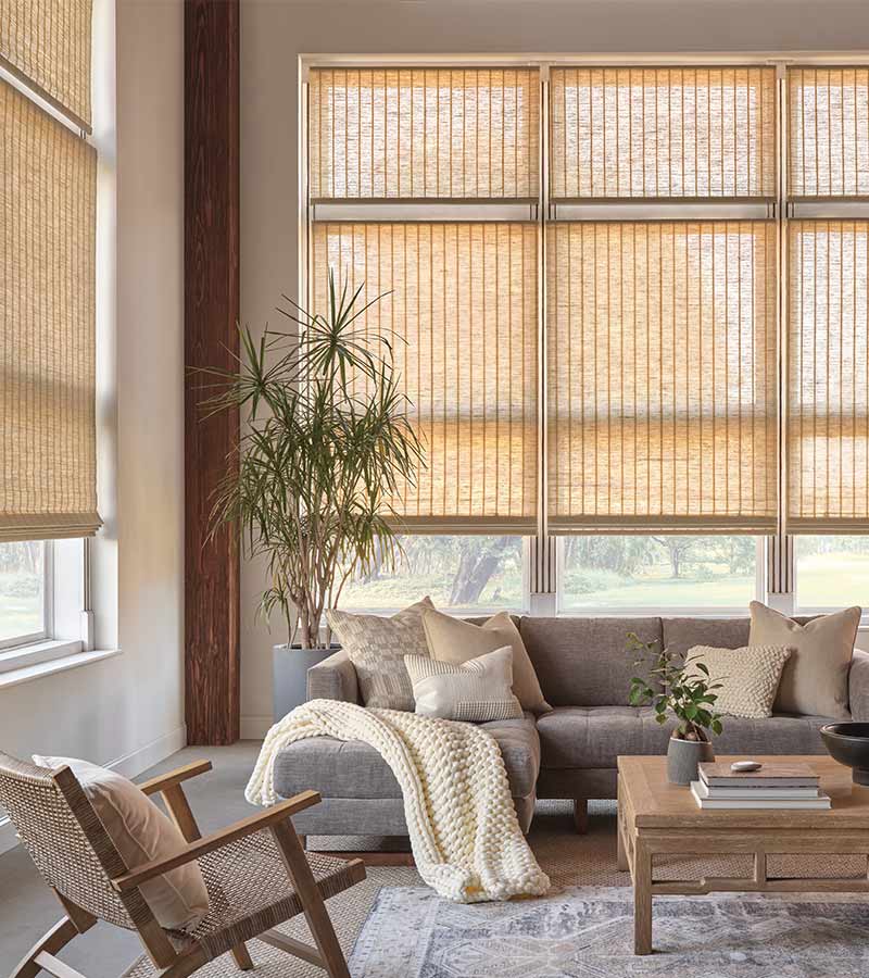 Living room with textured woven wood shades
