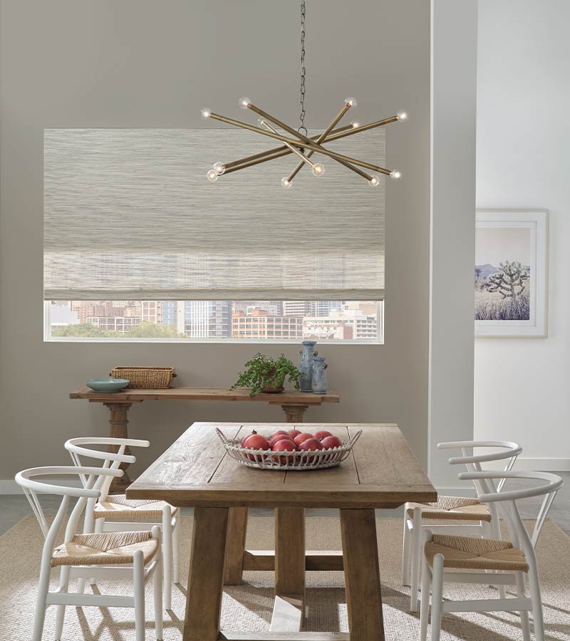 dining room with white dual woven wood shades