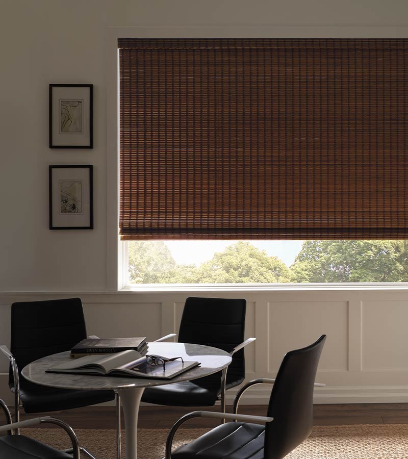 breakfast nook with neutral dual woven wood shades room darkening