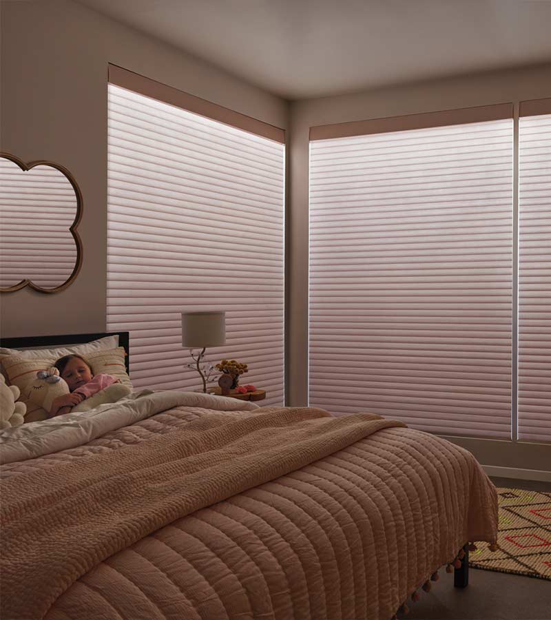 bedroom with aura illumination on sonnette roller shades
