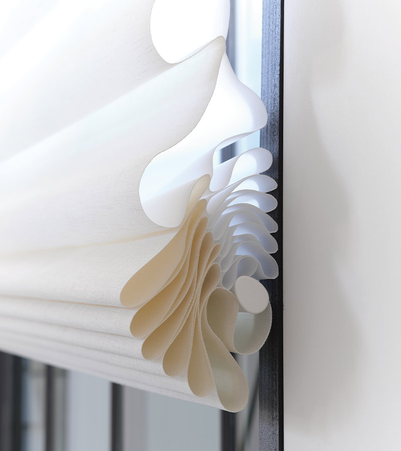 vignette-roman-shades-stacking-detail-hunter-douglas-california-window-fashions close up of stacking detail on roman shade