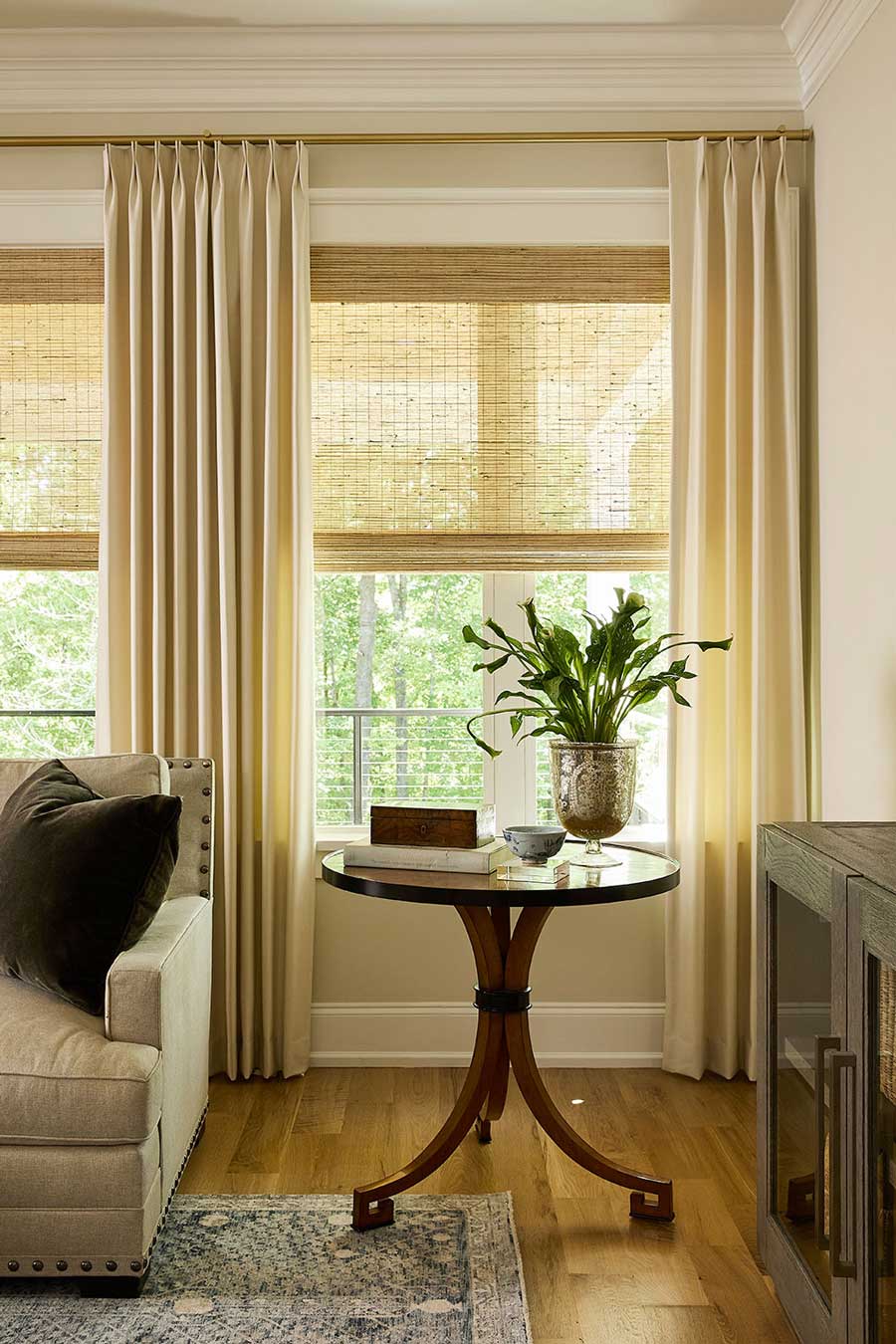 double pinch pleat drapes layered with bamboo shades in Roseville living room