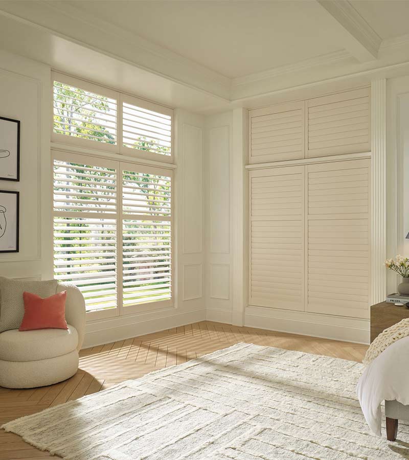 palm-beach-vinyl-large-window-shutters-california-window-fashions white vinyl shutters in bedroom