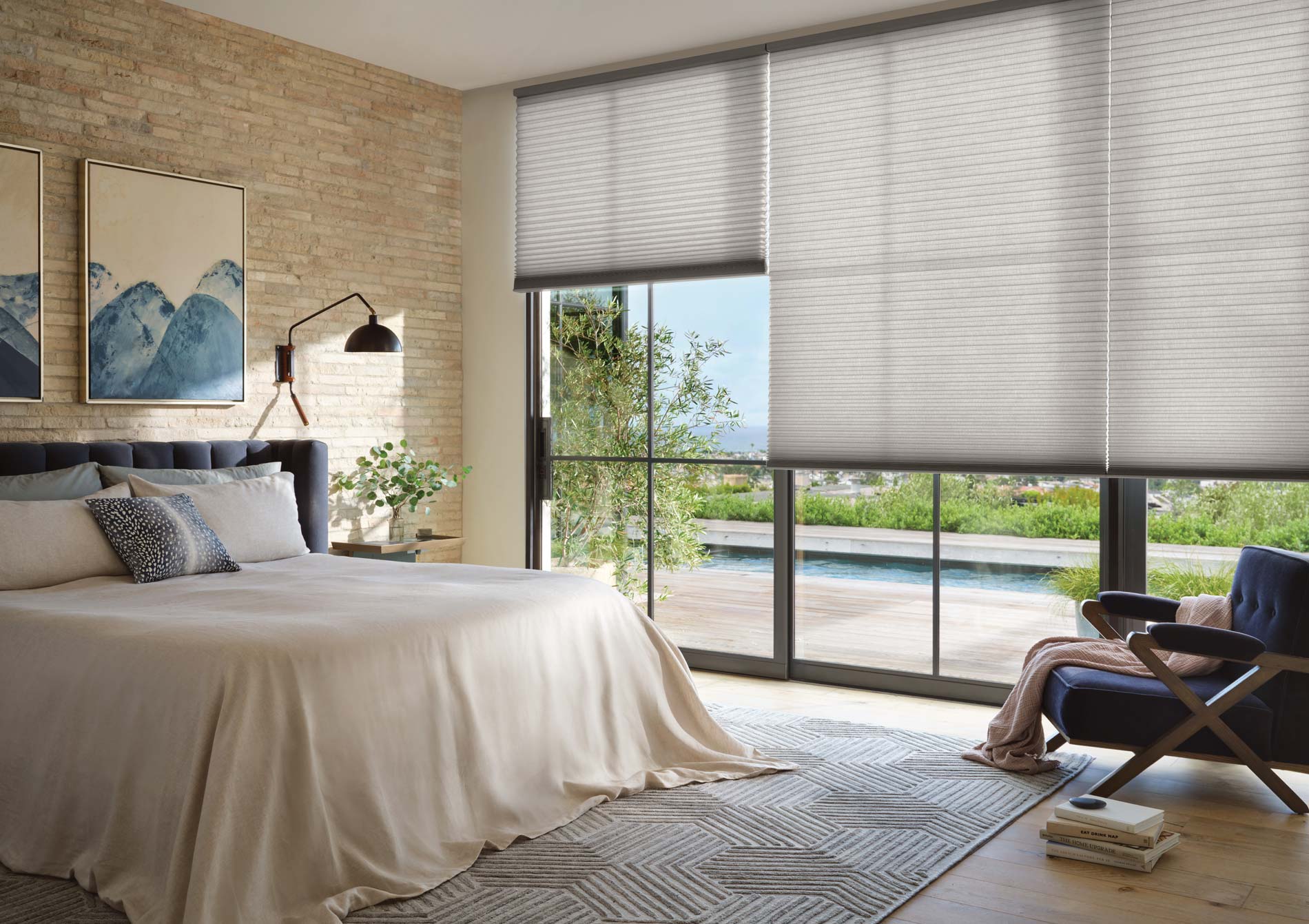 Duette® Honeycomb Shades covering sliding glass doors in a bedroom