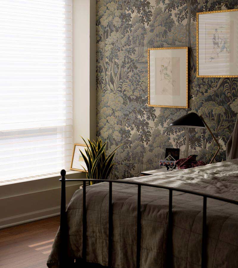 Silhouette® sheer shades diffusing natural light in a modern bedroom
