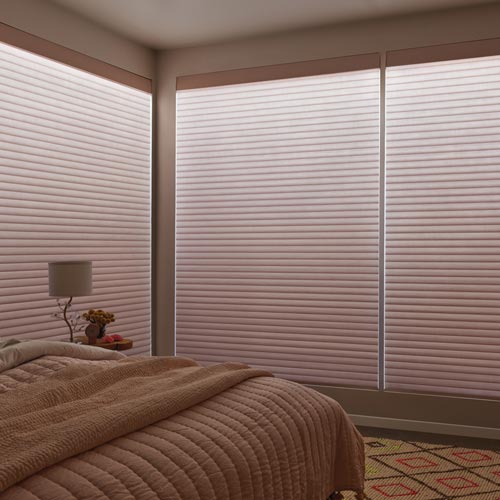 illuminated cellular roller shades with Aura lighting feature